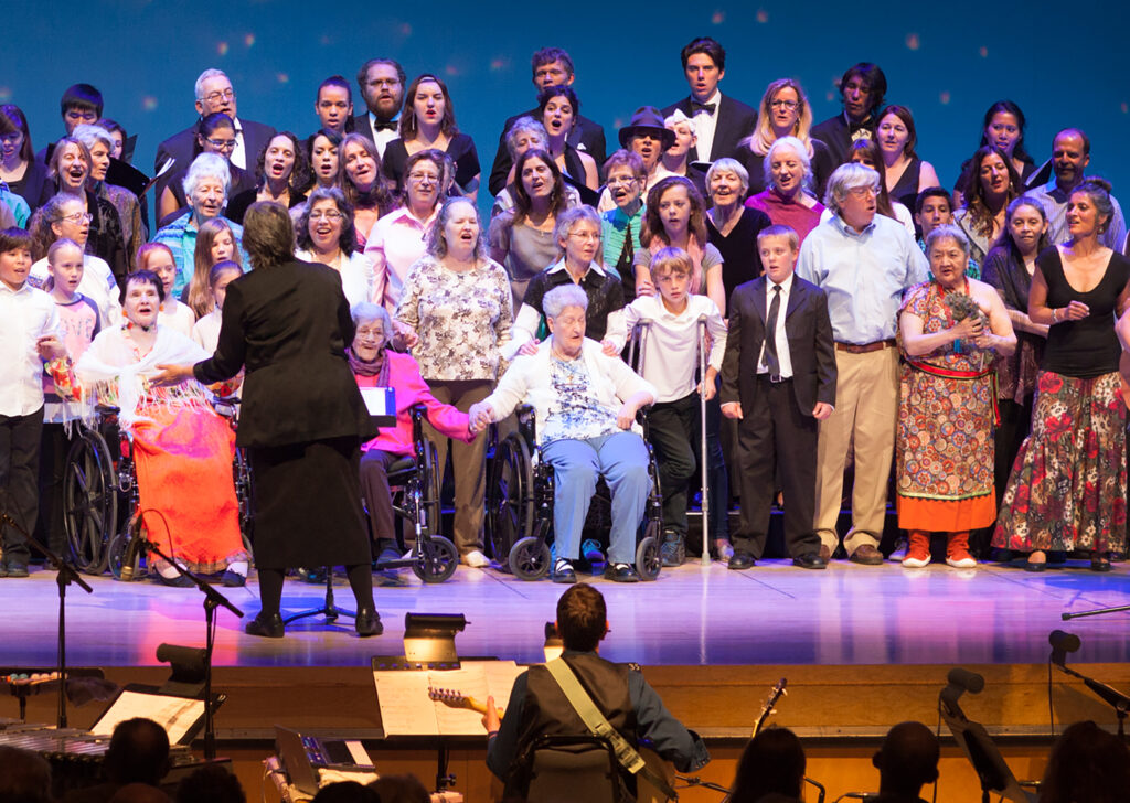 Opus people on stage singing